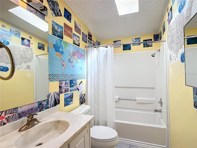 full bathroom featuring vanity, toilet, a textured ceiling, and shower / tub combo with curtain