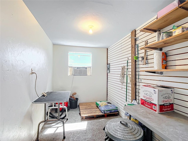 interior space with concrete floors and cooling unit