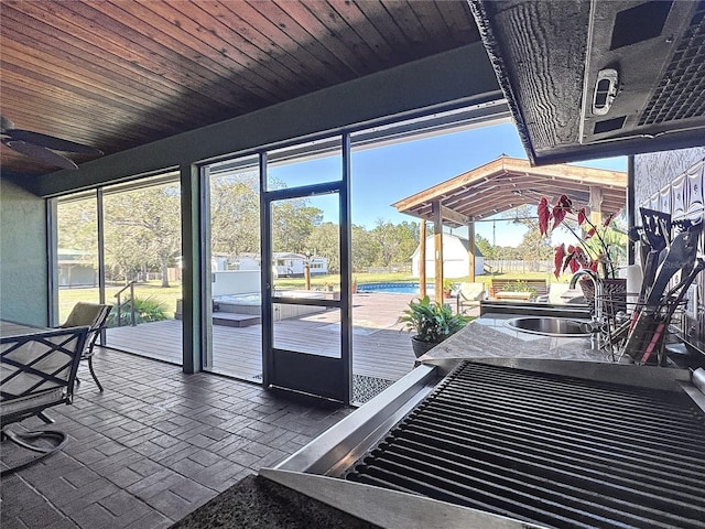 unfurnished sunroom featuring sink