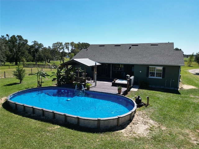 view of swimming pool with a patio area and a lawn