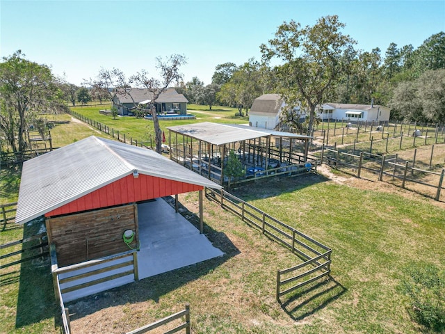 exterior space with a rural view and an outbuilding