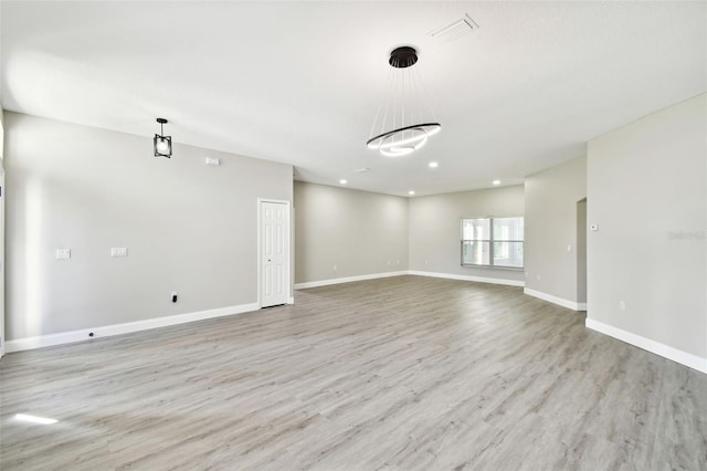 unfurnished room featuring light hardwood / wood-style floors