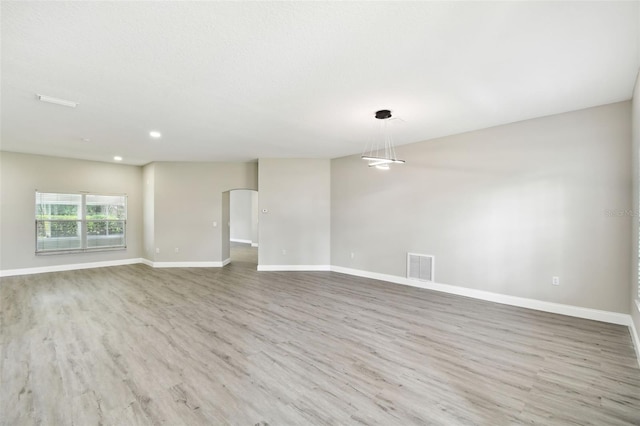 empty room featuring light hardwood / wood-style floors