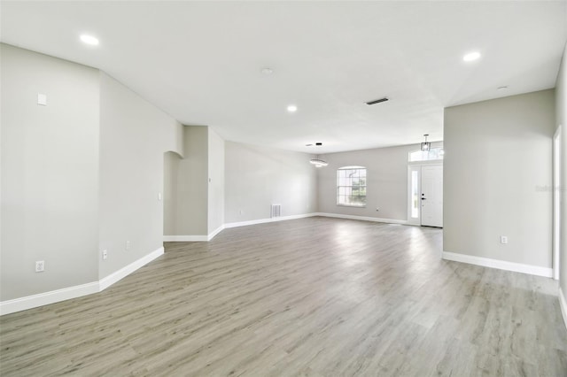 unfurnished living room with light hardwood / wood-style flooring