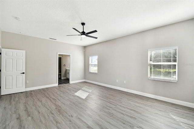 unfurnished room featuring light hardwood / wood-style flooring and ceiling fan