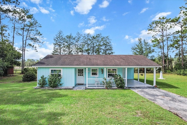 ranch-style house featuring a front yard, a carport, and a porch