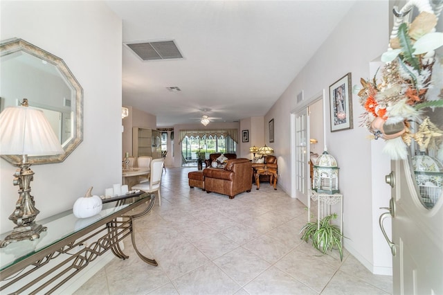 interior space featuring ceiling fan and light tile patterned flooring