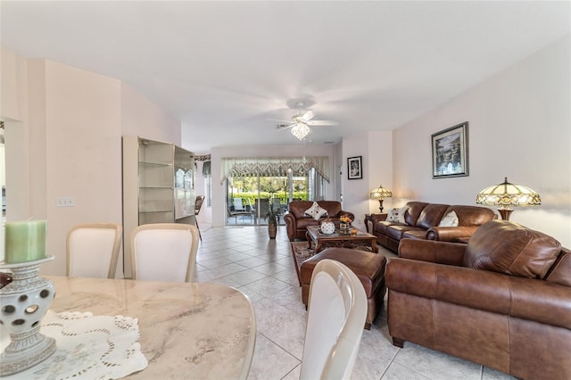 dining space with ceiling fan and light tile patterned floors