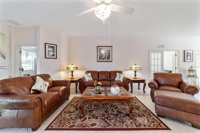 living room featuring light tile patterned floors and ceiling fan