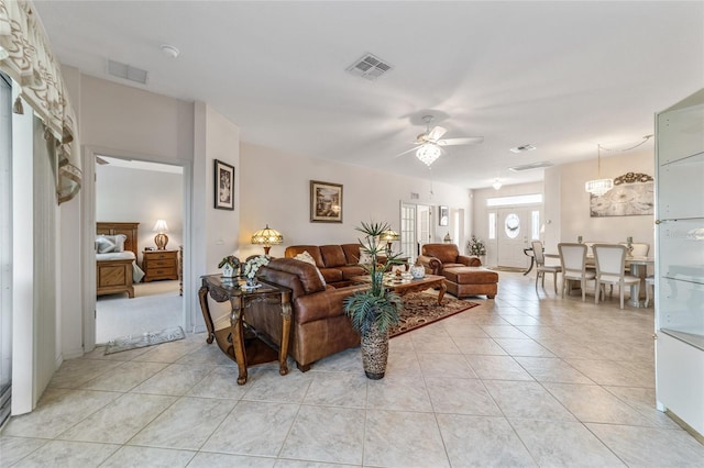 living room featuring light tile patterned flooring and ceiling fan