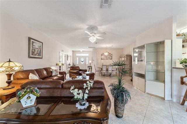 living room with light tile patterned flooring and ceiling fan