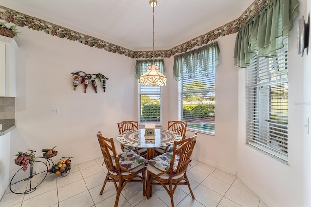 dining space featuring light tile patterned floors