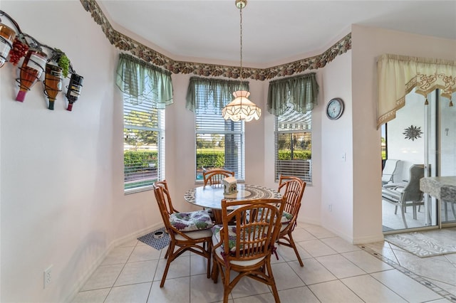 dining space with a healthy amount of sunlight and light tile patterned flooring