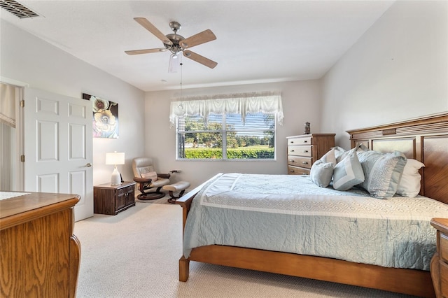 bedroom featuring light carpet and ceiling fan