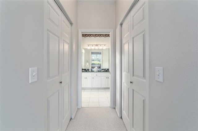 hallway featuring light tile patterned floors