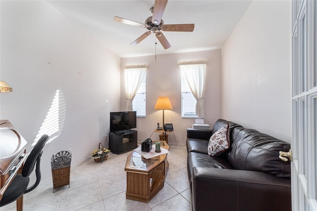 living room with ceiling fan and light tile patterned flooring