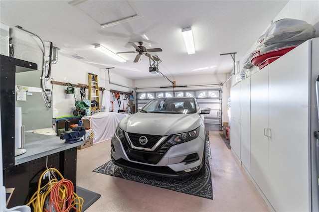 garage featuring ceiling fan and a garage door opener