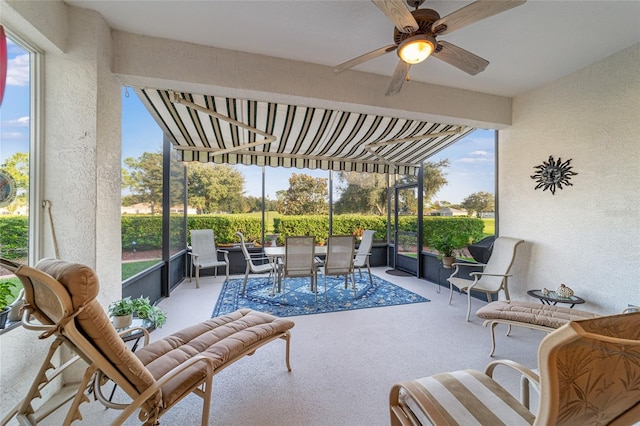 sunroom / solarium with ceiling fan