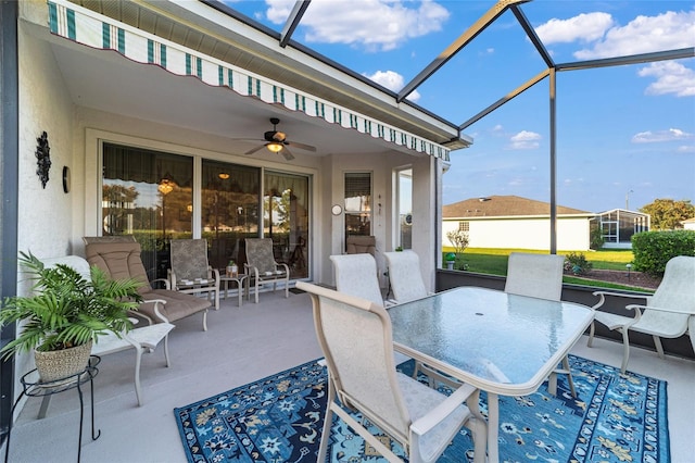 sunroom featuring ceiling fan