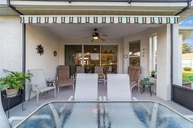 view of swimming pool featuring a patio area and ceiling fan