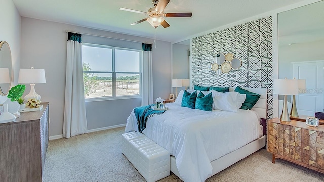 bedroom with ceiling fan and light colored carpet