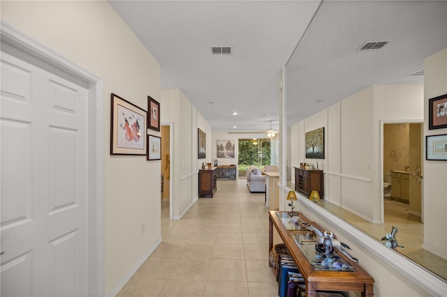 hallway with light tile patterned flooring