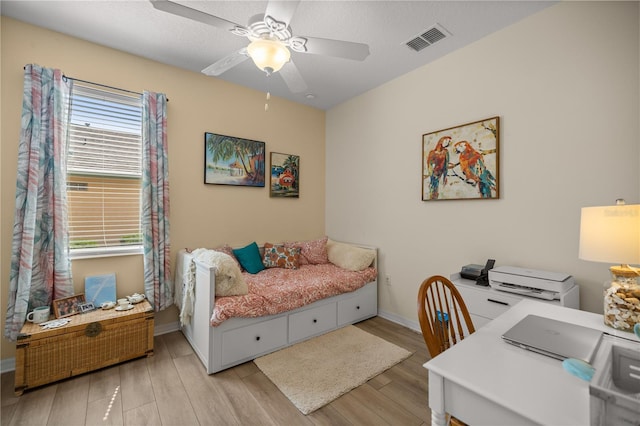 bedroom featuring ceiling fan and light wood-type flooring