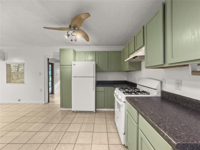 kitchen featuring white appliances, green cabinetry, a textured ceiling, ceiling fan, and light tile patterned floors