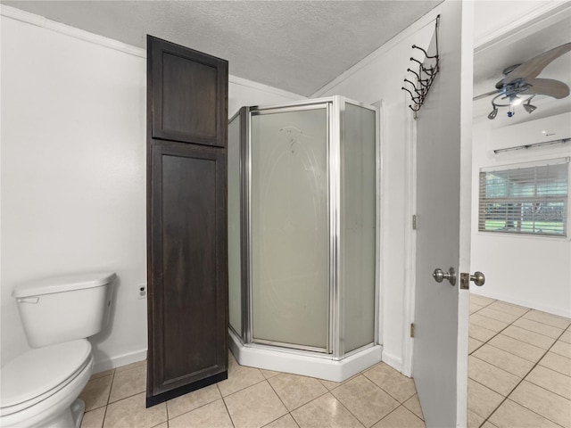 bathroom with toilet, tile patterned flooring, and an enclosed shower