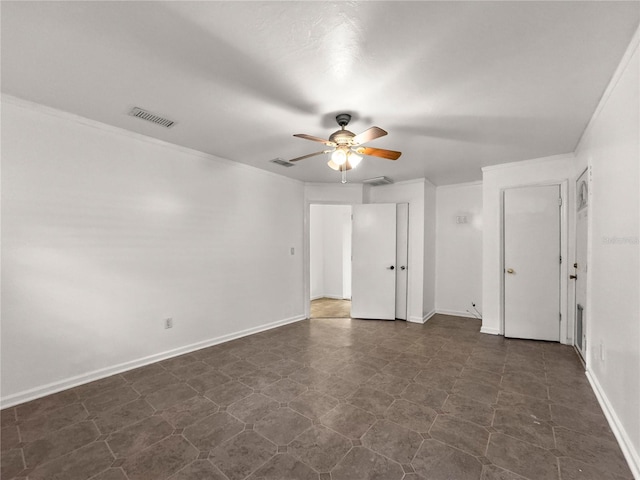 empty room featuring ornamental molding and ceiling fan