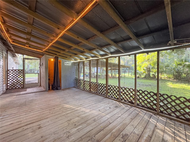 unfurnished sunroom with vaulted ceiling