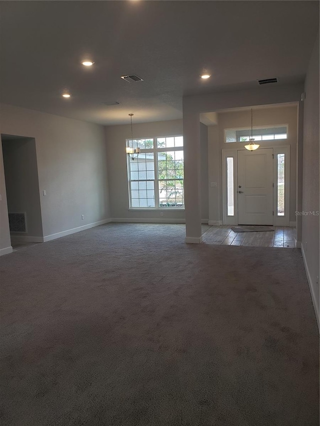 view of carpeted entrance foyer