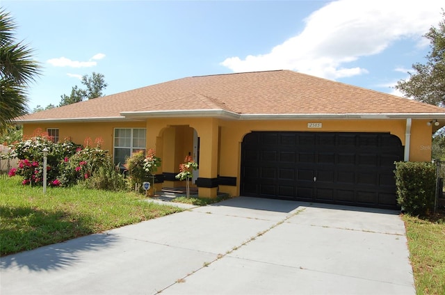 ranch-style house featuring a garage