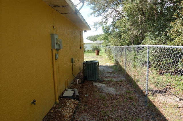 view of yard with central AC unit