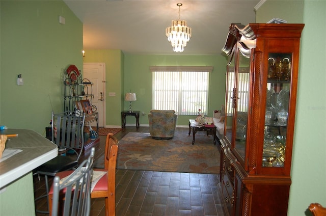 dining area featuring a notable chandelier and dark wood-type flooring