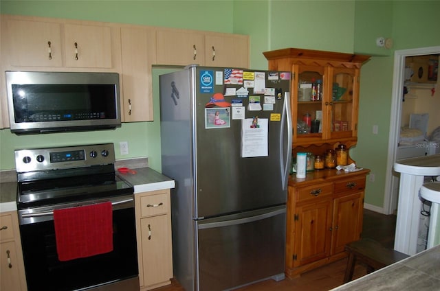 kitchen featuring hardwood / wood-style floors and stainless steel appliances