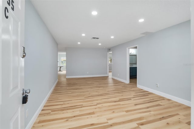 unfurnished room featuring light hardwood / wood-style flooring