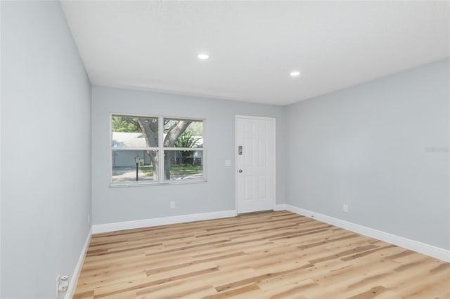 unfurnished room featuring light hardwood / wood-style flooring