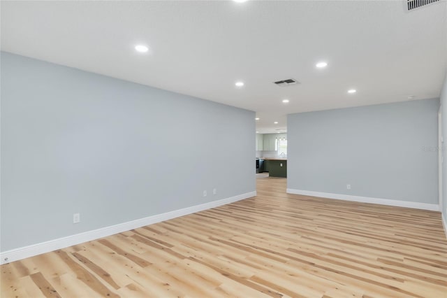 spare room featuring light hardwood / wood-style floors