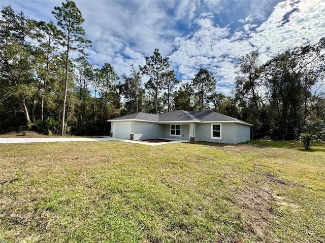 exterior space featuring a lawn and a garage