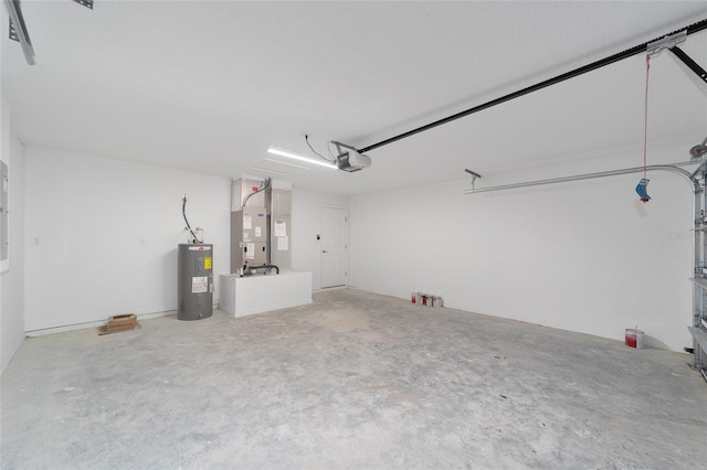 garage featuring electric water heater, heating unit, and a garage door opener