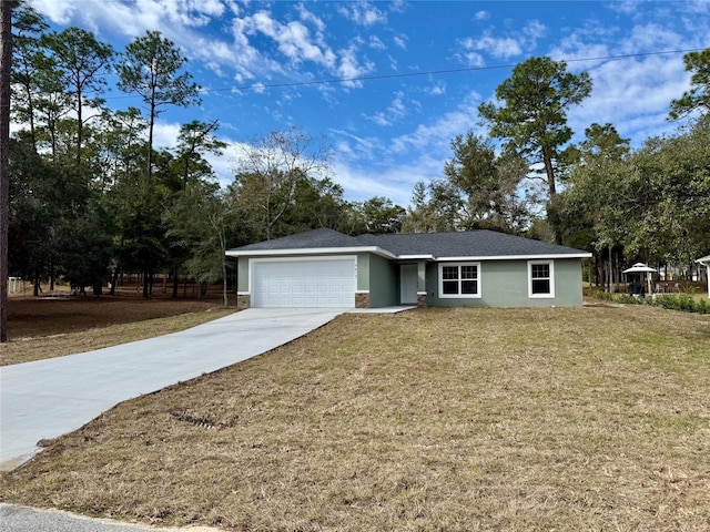 single story home with a garage and a front lawn