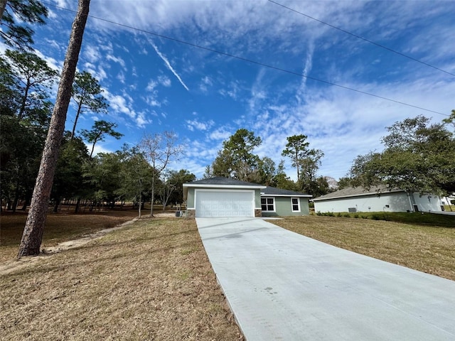 ranch-style house with a garage and a front yard