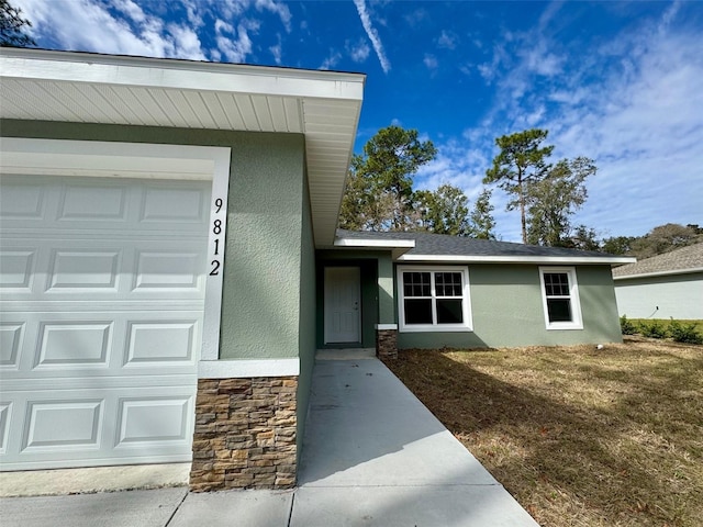 property entrance with a garage