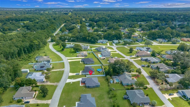bird's eye view featuring a forest view and a residential view