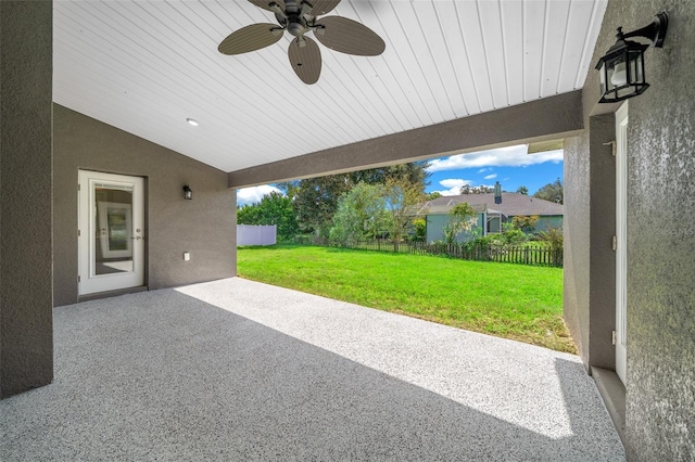 view of patio featuring fence and a ceiling fan