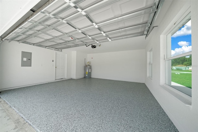 garage featuring electric water heater and electric panel