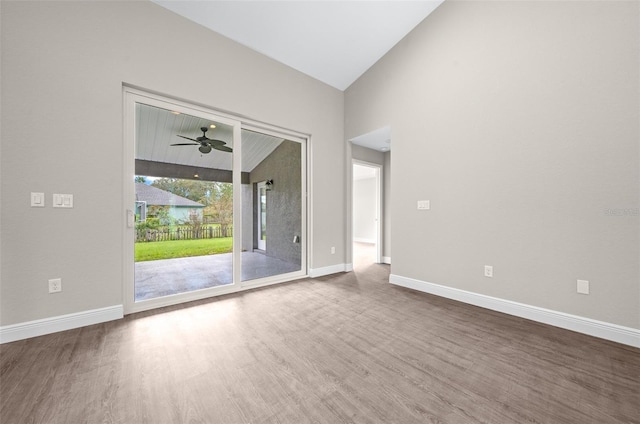 interior space with vaulted ceiling, wood-type flooring, and ceiling fan