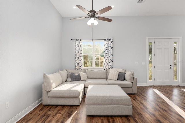 living room with dark wood-type flooring and ceiling fan