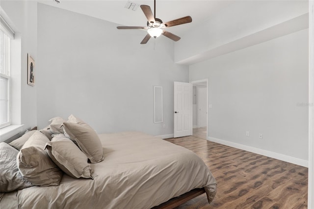 bedroom with wood-type flooring and ceiling fan